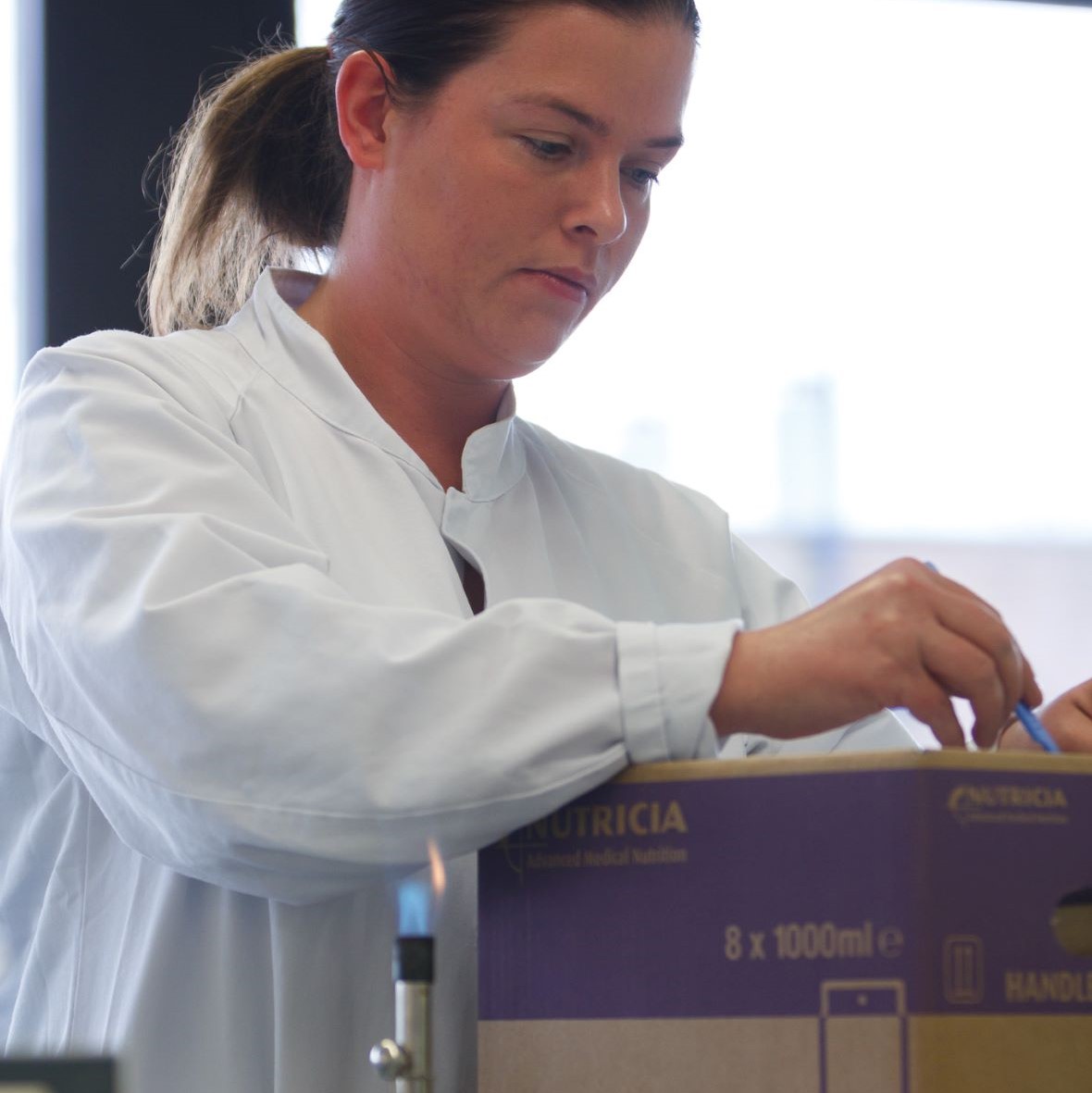 Factory worker with Nutricia box at Zoetermeer Supply Point